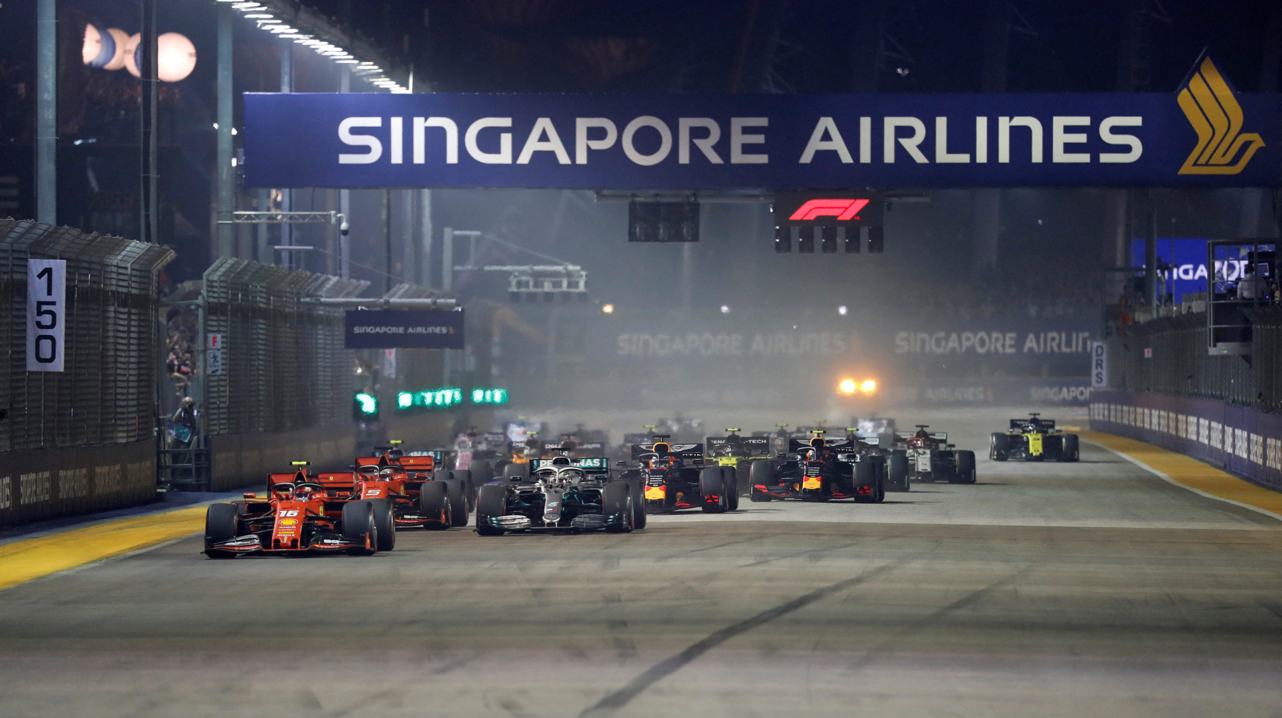 FILE PHOTO: Formula One F1 - Singapore Grand Prix - Marina Bay Street Circuit, Singapore - September 22, 2019 Ferrari's Charles Leclerc leads at the start of the race 