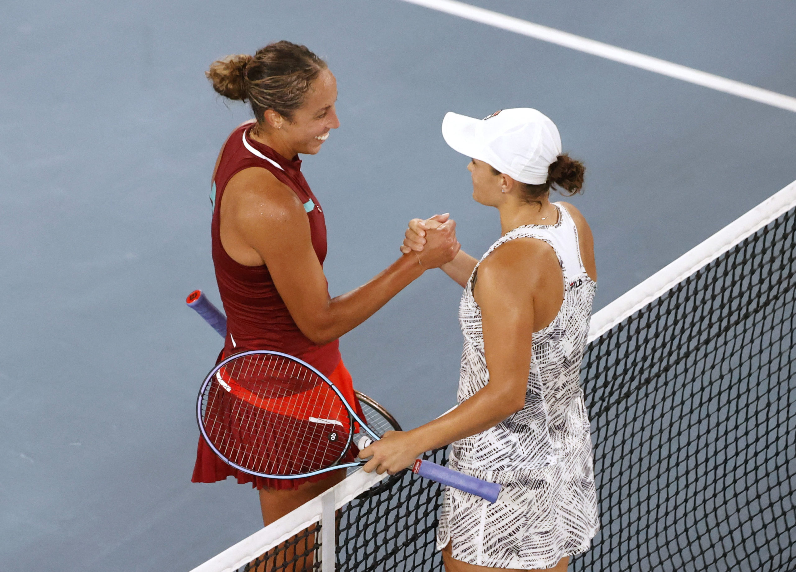 Tennis - Australian Open - Melbourne Park, Melbourne, Australia - January 27, 2022  Madison Keys of the U.S. and Australia's Ashleigh Barty shake hands after their semi final match 