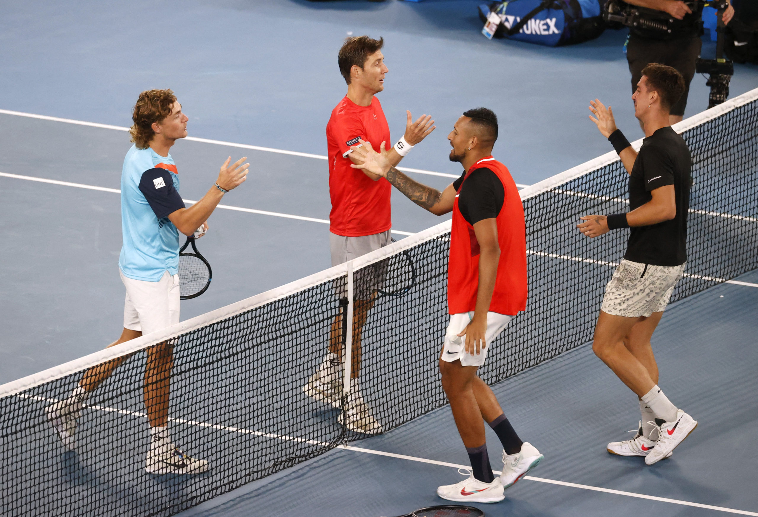 bles Final - Melbourne Park, Melbourne, Australia - January 29, 2022 Australia's Nick Kyrgios and Thanasi Kokkinakis shake hands with Australia's Matthew Ebden and Max Purcell after the final 