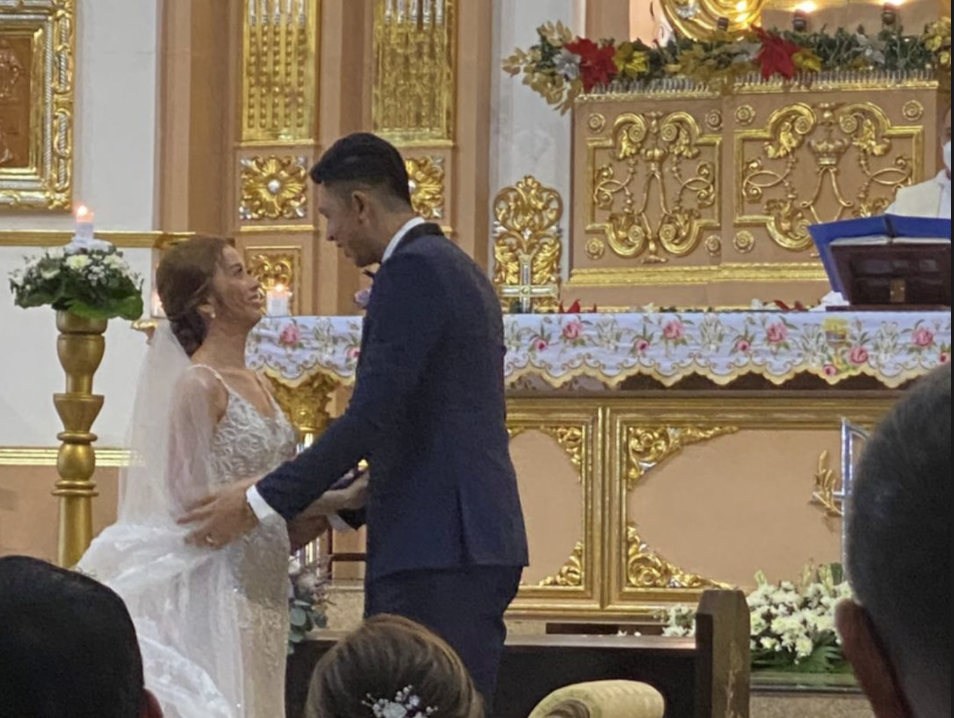 Kevin Ferrer and wife MM Belarmino get married in a church ceremony. 