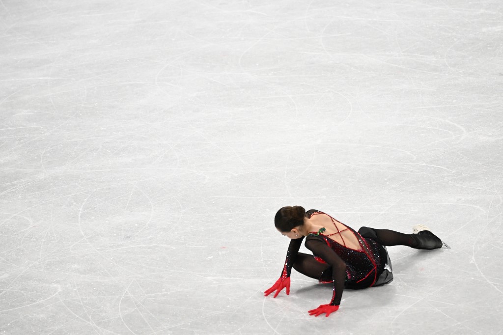 amila Valieva falls as she competes in the women's single skating free skating of the figure skating event during the Beijing 2022 Winter Olympic Games at the Capital Indoor Stadium in Beijing on February 17, 2022.