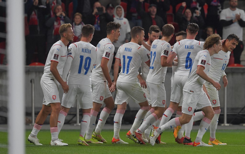 Czech Republic's players celebrate after scoring during the FIFA World Cup Qatar 2022 qualification Group E football match between the Czech Republic and Wales, at the Sinobo stadium in Prague, Czech Republic on October 8, 2021. 