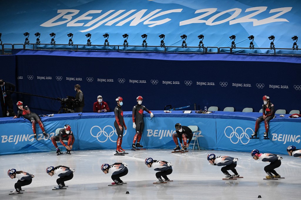 Canada's and South Korea's short track speed skaters take part in a training session at the Capital Indoor Stadium in Beijing on January 31, 2022 ahead of the Beijing 2022 Winter Olympics Games. 