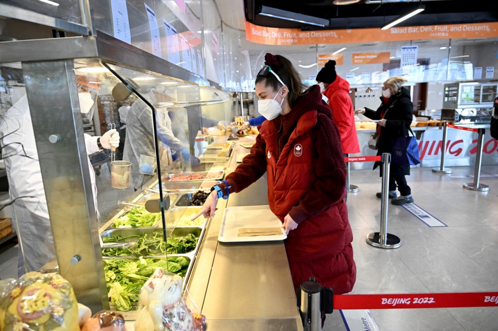Athletes prepare to order food at a restaurant in Beijing 2022 Winter Olympic Games village in Beijing on February 1, 2022, ahead of the 2022 Beijing Winter Olympic Games. 