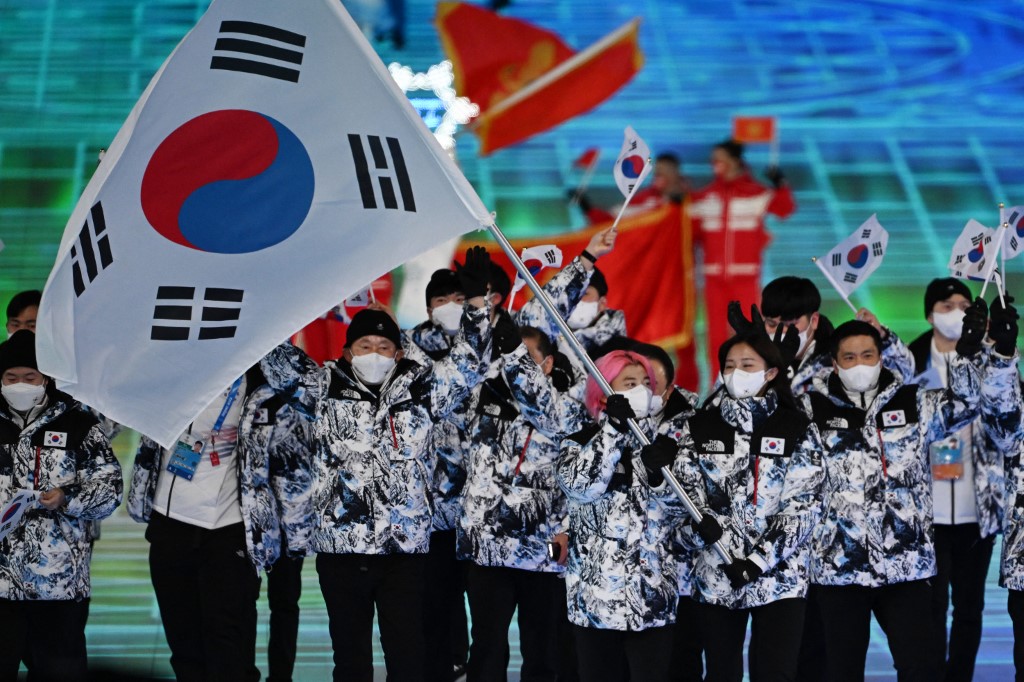 South Korea's flag bearer Kwak Yoon-gy and South Korea's flag bearer Kim A-lang lead the delegation during the opening ceremony of the Beijing 2022 Winter Olympic Games, at the National Stadium, known as the Bird's Nest, in Beijing, on February 4, 2022. 
