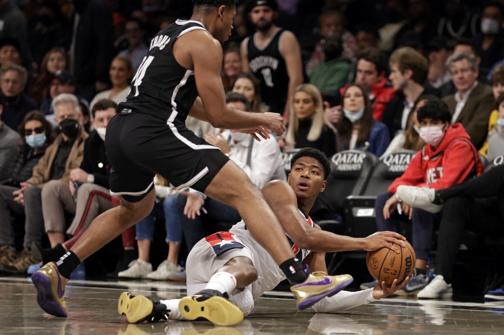 Rui Hachimura #8 of the Washington Wizards looks to pass around Kessler Edwards #14 of the Brooklyn Nets during the second half at Barclays Center on February 17, 2022 in New York City. 