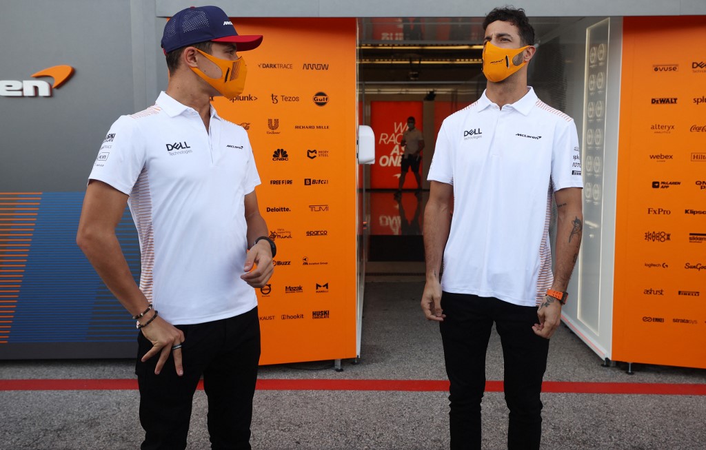 Daniel Ricciardo of Australia and McLaren F1 and Lando Norris of Great Britain and McLaren F1 talk in the 
