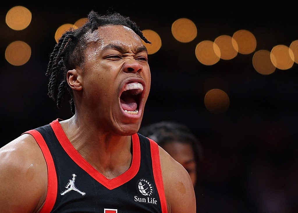 Scottie Barnes #4 of the Toronto Raptors reacts after a basket against the Atlanta Hawks during the first half at State Farm Arena on January 31, 2022 in Atlanta, Georgia. 