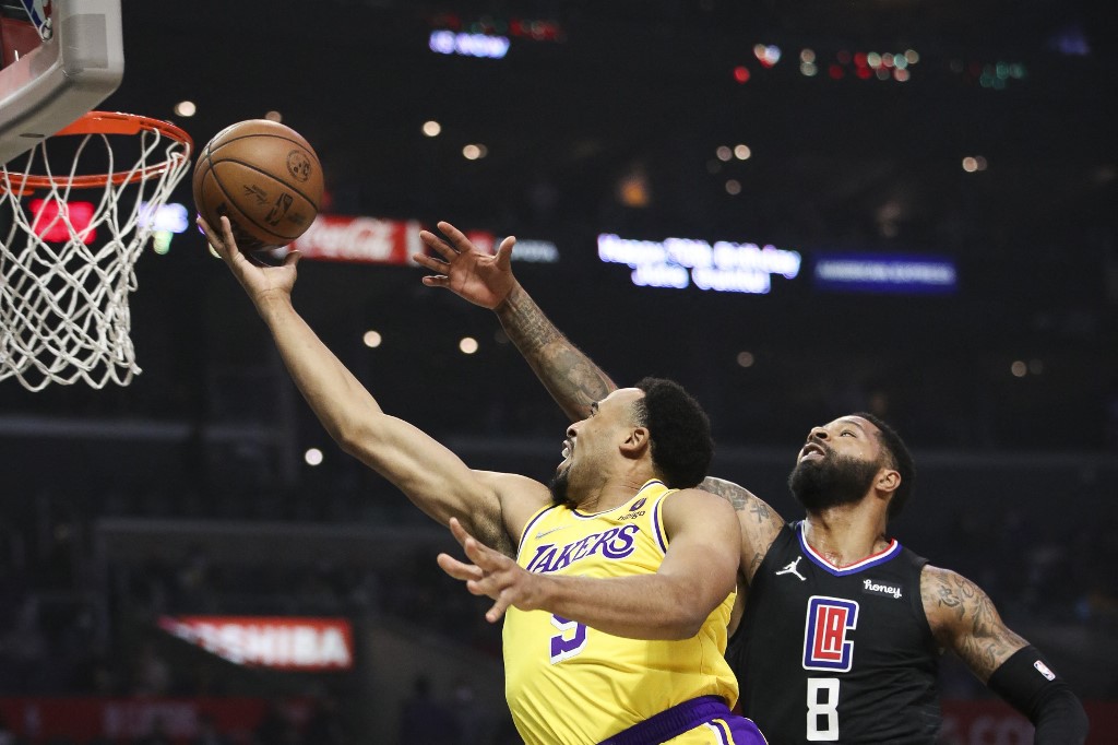 Talen Horton-Tucker #5 of the Los Angeles Lakers shoots against Marcus Morris Sr. #8 of the Los Angeles Clippers in the first half at Crypto.com Arena on February 03, 2022 in Los Angeles, California. 
