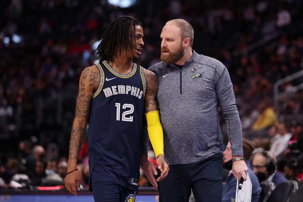 Ja Morant #12 of the Memphis Grizzlies talks with head coach Taylor Jenkins while playing the Detroit Pistons at Little Caesars Arena on February 10, 2022 in Detroit, Michigan.