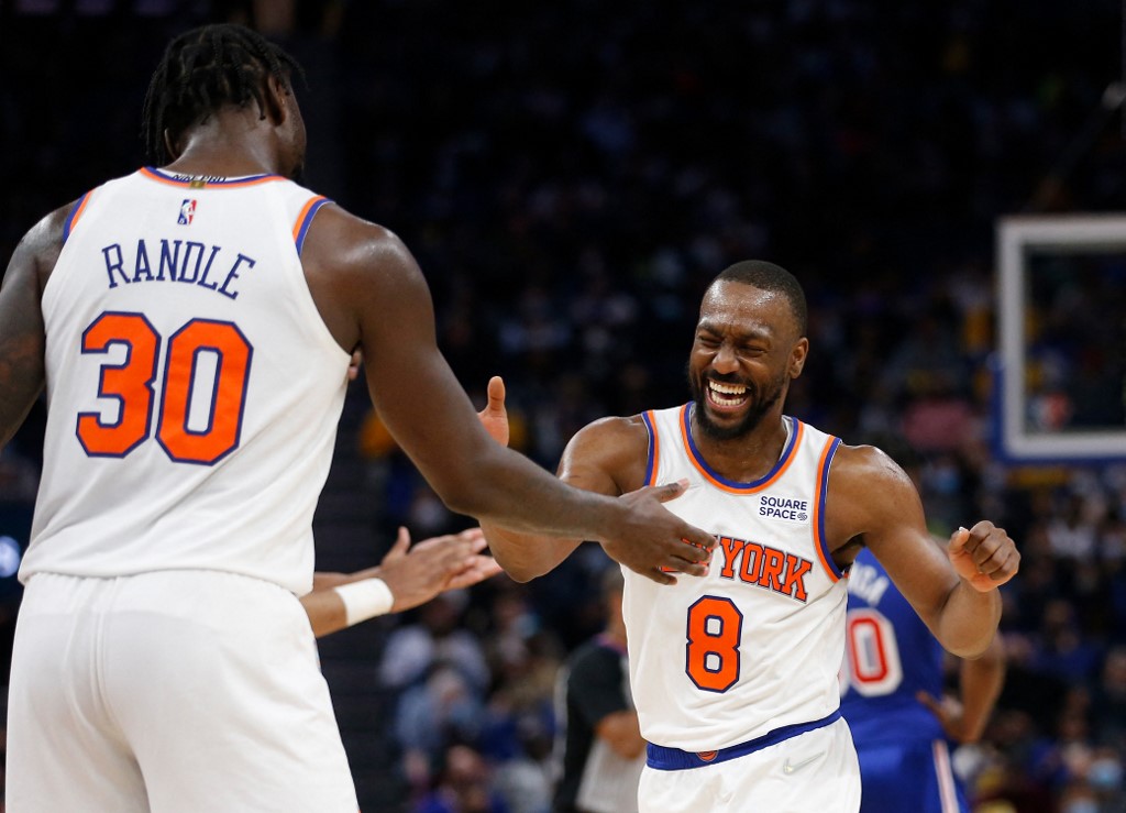 Kemba Walker #8 of the New York Knicks reacts with Julius Randle #30 after a play against the Golden State Warriors in the third quarter at Chase Center on February 10, 2022 in San Francisco, California.