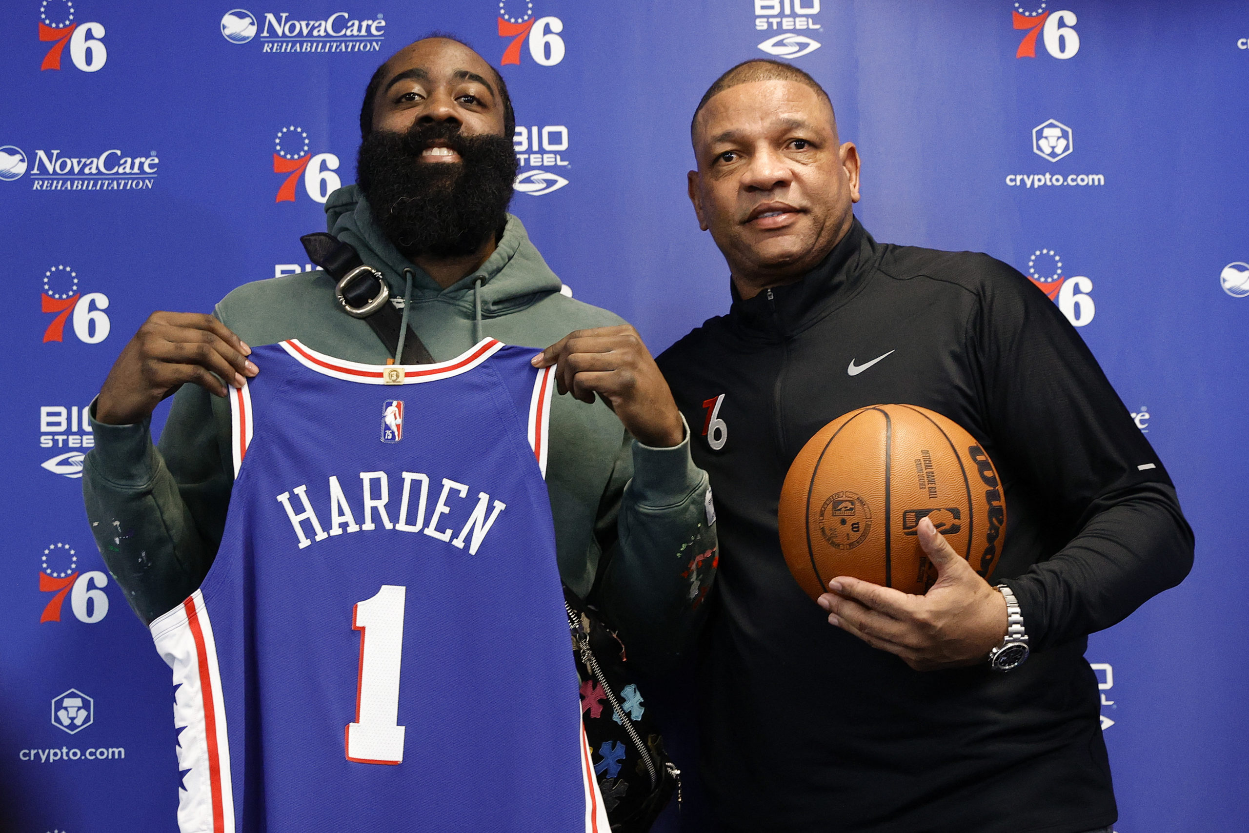 James Harden #1 and head coach Doc Rivers of the Philadelphia 76ers pose for photos during a press conference at the Seventy Sixers Practice Facility on February 15, 2022 in Camden, New Jersey. Tim Nwachukwu/Getty Images/AFP NOTE TO USER: User expressly acknowledges and agrees that, by downloading and or using this photograph, User is consenting to the terms and conditions of the Getty Images License Agreement. (Photo by Tim Nwachukwu / GETTY IMAGES NORTH AMERICA / Getty Images via AFP)