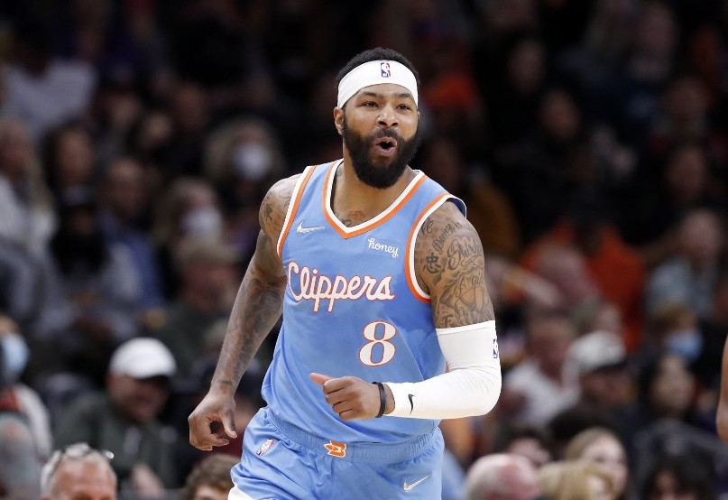 Marcus Morris Sr. #8 of the Los Angeles Clippers reacts after a three point basket during the first half against the Phoenix Suns at Footprint Center on February 15, 2022 in Phoenix, Arizona.
