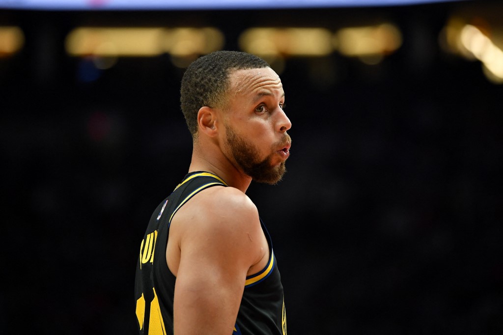  Stephen Curry #30 of the Golden State Warriors reacts to a three-point basket during the second quarter against the Portland Trail Blazers at the Moda Center on February 24, 2022 in Portland, Oregon. The Golden State Warriors won 132-95.