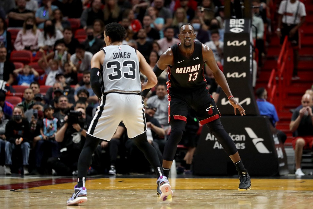 Bam Adebayo #13 of the Miami Heat defends Tre Jones #33 of the San Antonio Spurs during their game at FTX Arena on February 26, 2022 in Miami, Florida.