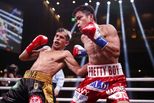 LAS VEGAS, NEVADA - FEBRUARY 26: Fernando Martinez (L) lands a body shot on IBF super flyweight champion Jerwin Ancajas during a title fight at The Chelsea at The Cosmopolitan of Las Vegas on February 26, 2022 in Las Vegas, Nevada. Martinez took the title by unanimous decision.