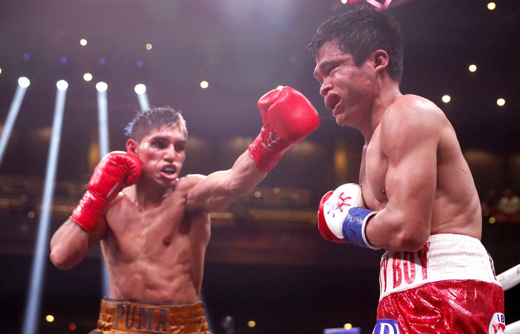 LAS VEGAS, NEVADA - FEBRUARY 26: Fernando Martinez (L) punches IBF super flyweight champion Jerwin Ancajas during a title fight at The Chelsea at The Cosmopolitan of Las Vegas on February 26, 2022 in Las Vegas, Nevada. Martinez took the title by unanimous decision.  