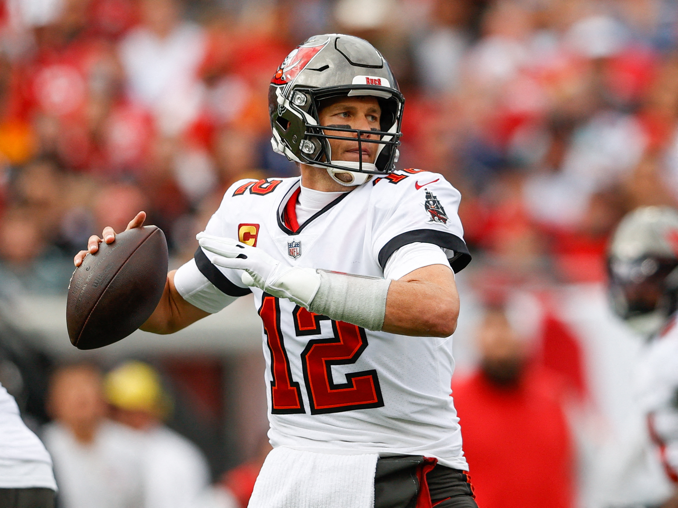 FILE PHOTO: Jan 16, 2022; Tampa, Florida, USA; Tampa Bay Buccaneers quarterback Tom Brady (12) drops back to pass in the first half against the Philadelphia Eagles in a NFC Wild Card playoff football game at Raymond James Stadium. 