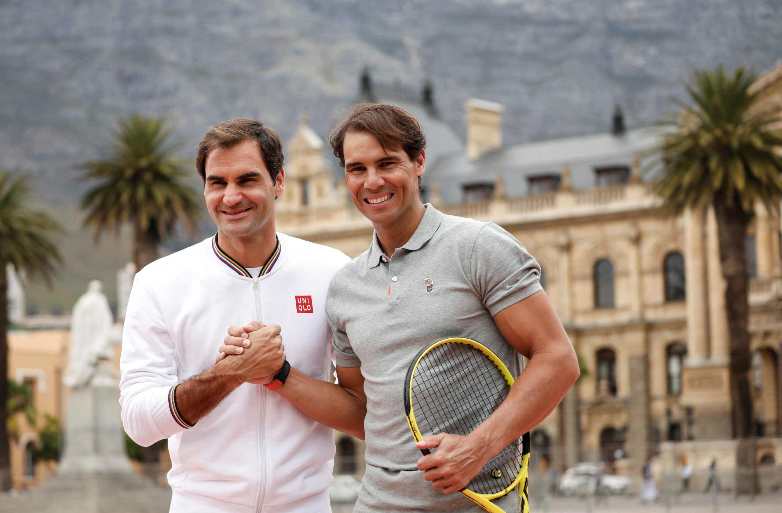 FILE PHOTO: Roger Federer and Rafael Nadal pose for photographers ahead of their "Match in Africa" exhibition tennis match in Cape Town, South Africa, February 7, 2020.
