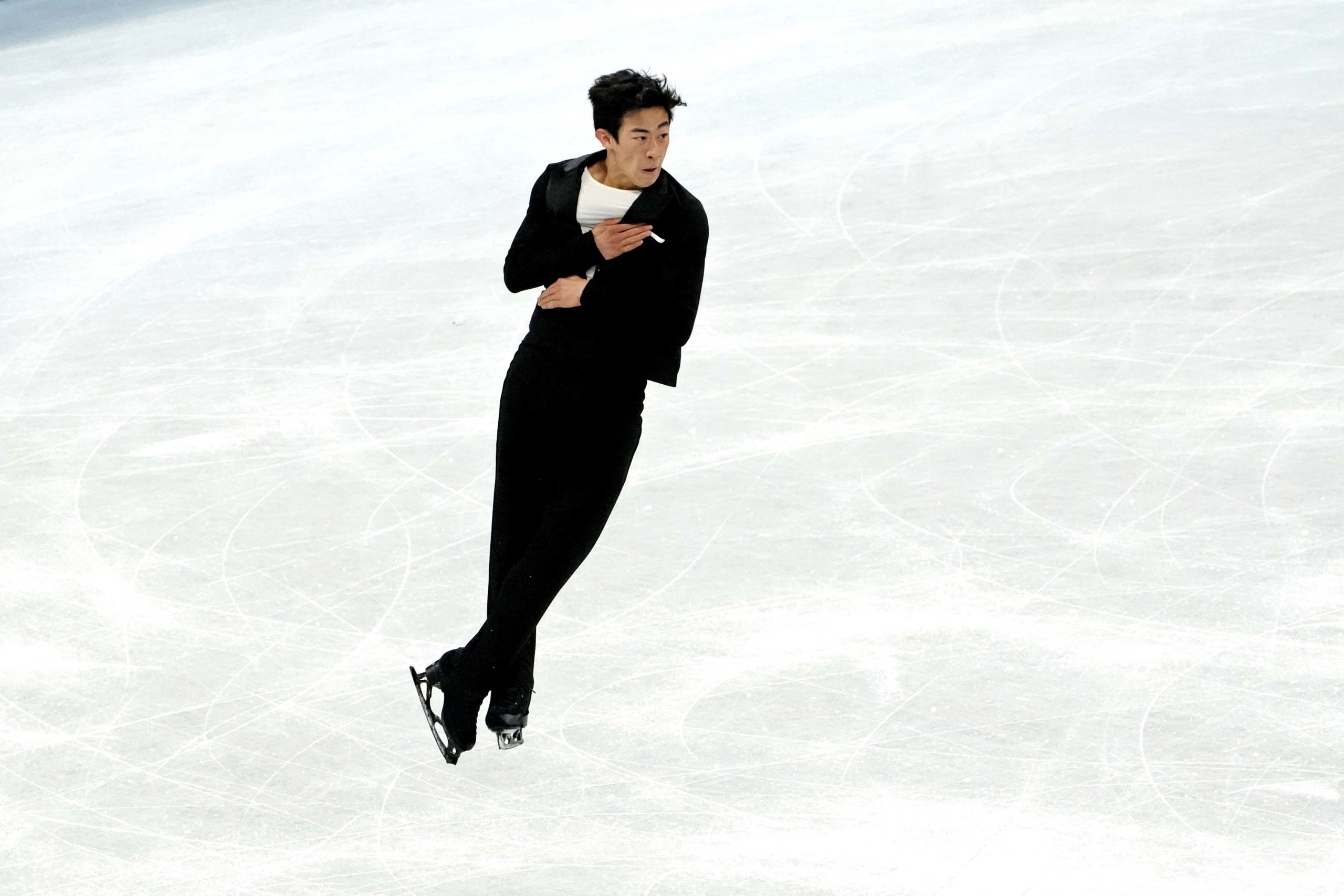 Feb 4, 2022; Beijing, China; Nathan Chen (USA) competes in the team figure skating men’s short program event during the Beijing 2022 Olympic Winter Games at Capital Indoor Stadium. 