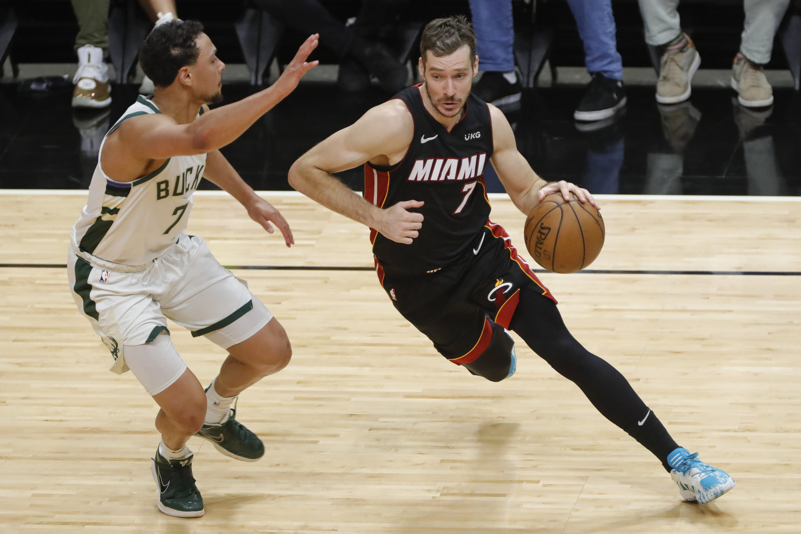 FILE PHOTO: May 29, 2021; Miami, Florida, USA; Miami Heat guard Goran Dragic (right) dribbles the basketball against Milwaukee Bucks guard Bryn Forbes (left) during the second quarter of game four in the first round of the 2021 NBA Playoffs at American Airlines Arena. 