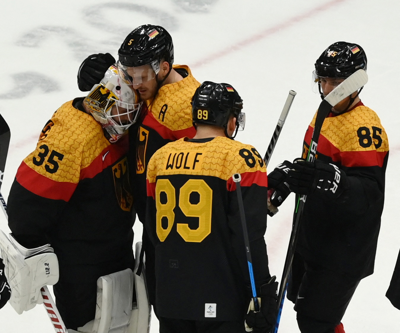 2022 Beijing Olympics - Ice Hockey - Men's Prelim. Round - Group A - Germany v China - National Indoor Stadium, Beijing, China - February 12, 2022. Germany players celebrate after the match. 