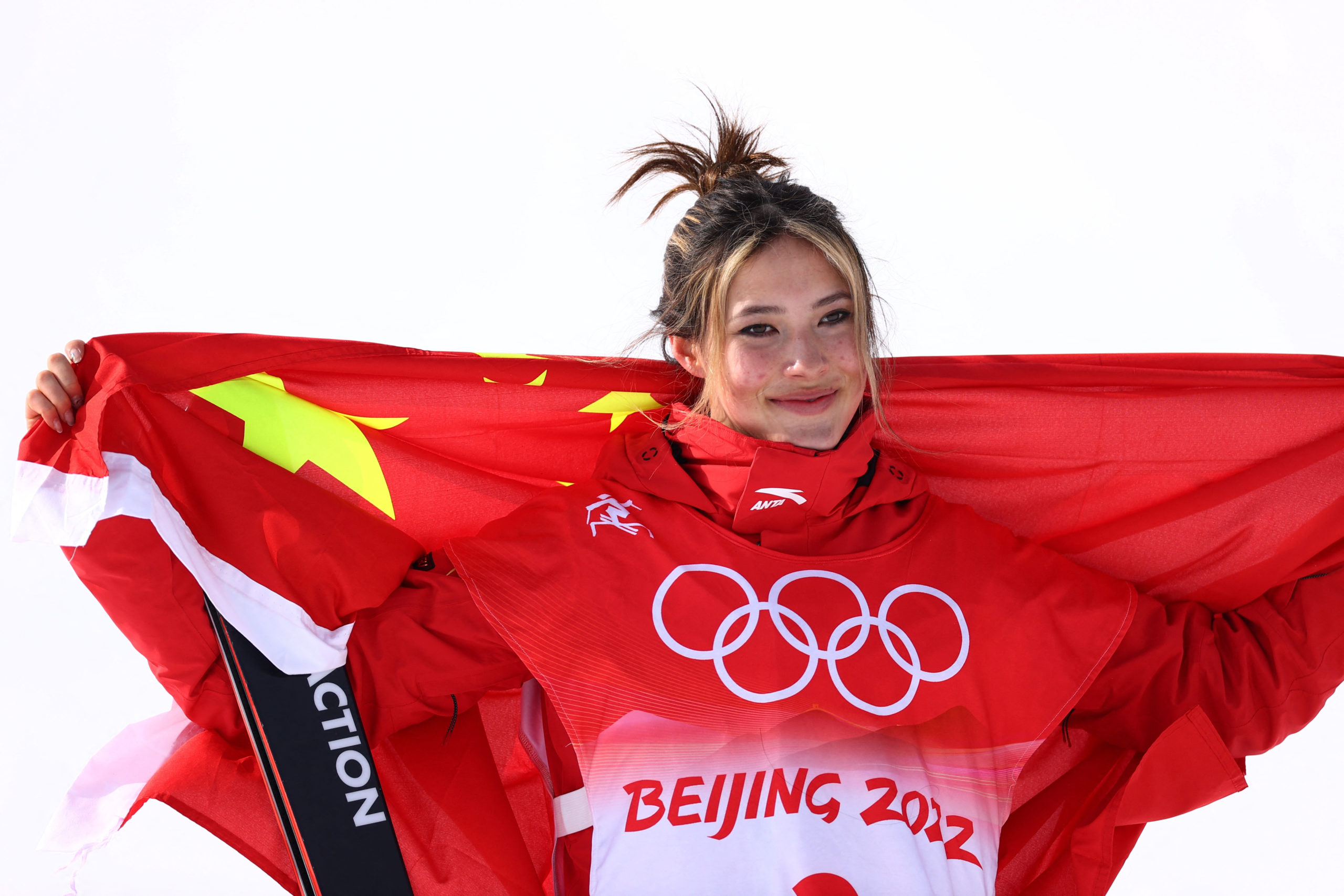 2022 Beijing Olympics - Freestyle Skiing - Women's Freeski Slopestyle - Final - Genting Snow Park, Zhangjiakou, China - February 15, 2022. Silver medallist Gu Ailing Eileen of China celebrates during the flower ceremony