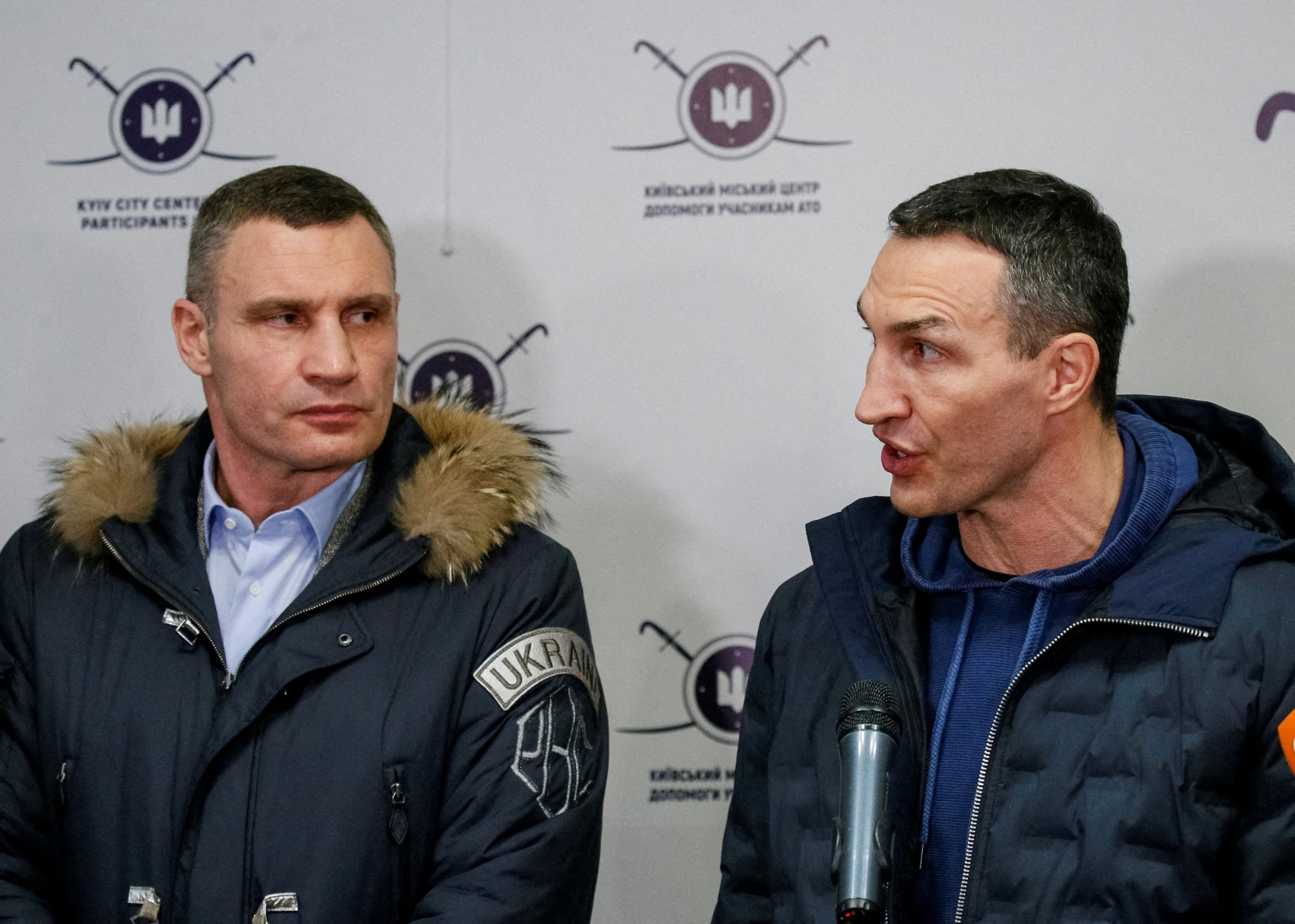 FILE PHOTO: Ukrainian heavyweight boxing world champion Wladimir Klitschko who joined the Ukrainian Territorial Defence Forces and his brother, Mayor of Kyiv and former heavyweight boxing champion Vitaly Klitschko, speak with journalists during the opening of the first Ukrainian Territorial Defence Forces recruitment centre in central Kyiv, Ukraine, February 2, 2022. 