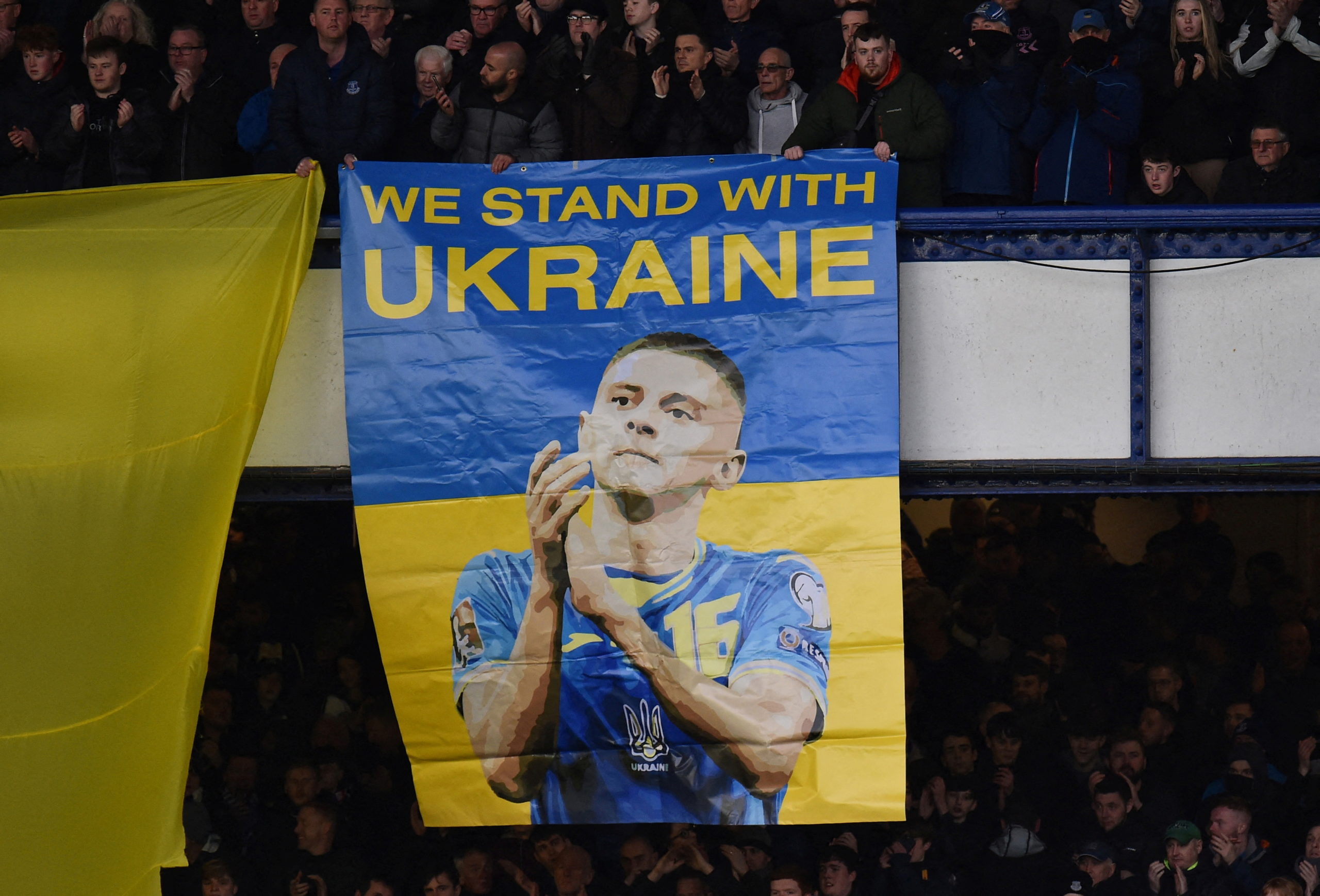 Soccer Football - Premier League - Everton v Manchester City - Goodison Park, Liverpool, Britain - February 26, 2022 Fans hold a banner in support of Ukraine before the match 