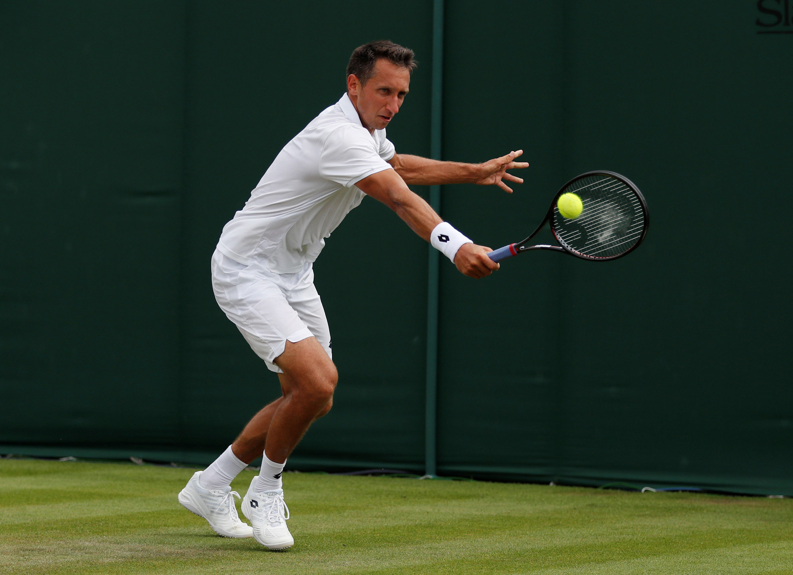FILE PHOTO: Tennis - Wimbledon - All England Lawn Tennis and Croquet Club, London, Britain - July 4, 2018  Ukraine's Sergiy Stakhovsky in action during the second round match against Sam Querrey of the U.S.  