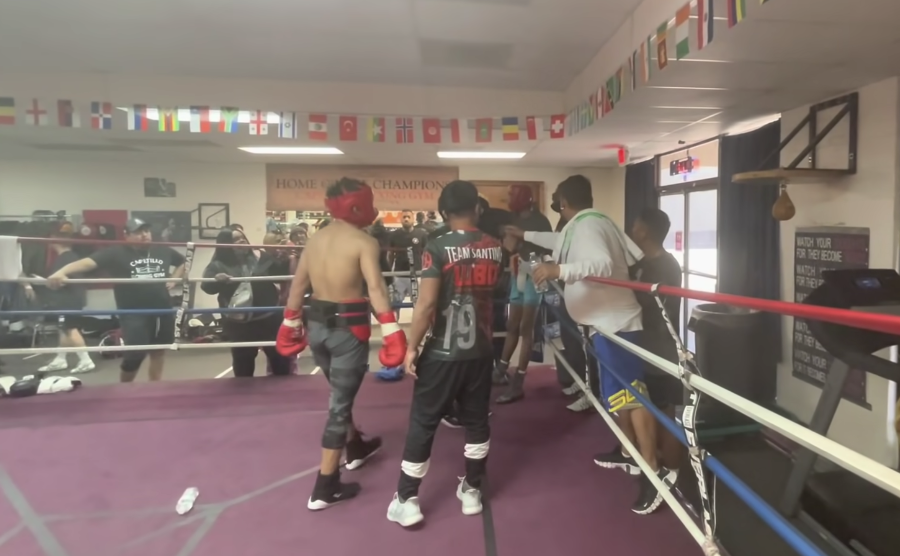A scuffle ensued after a water bottle was thrown at Jerwin Ancajas (red gloves) during a sparring session. 
