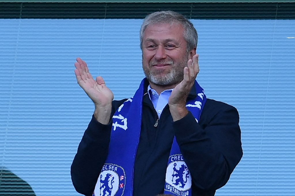 (FILES) In this file photo taken on May 21, 2017 (FILES) In this file photo taken on May 21, 2017 Chelsea's Russian owner Roman Abramovich applauds, as players celebrate their league title win at the end of the Premier League football match between Chelsea and Sunderland at Stamford Bridge in London. 