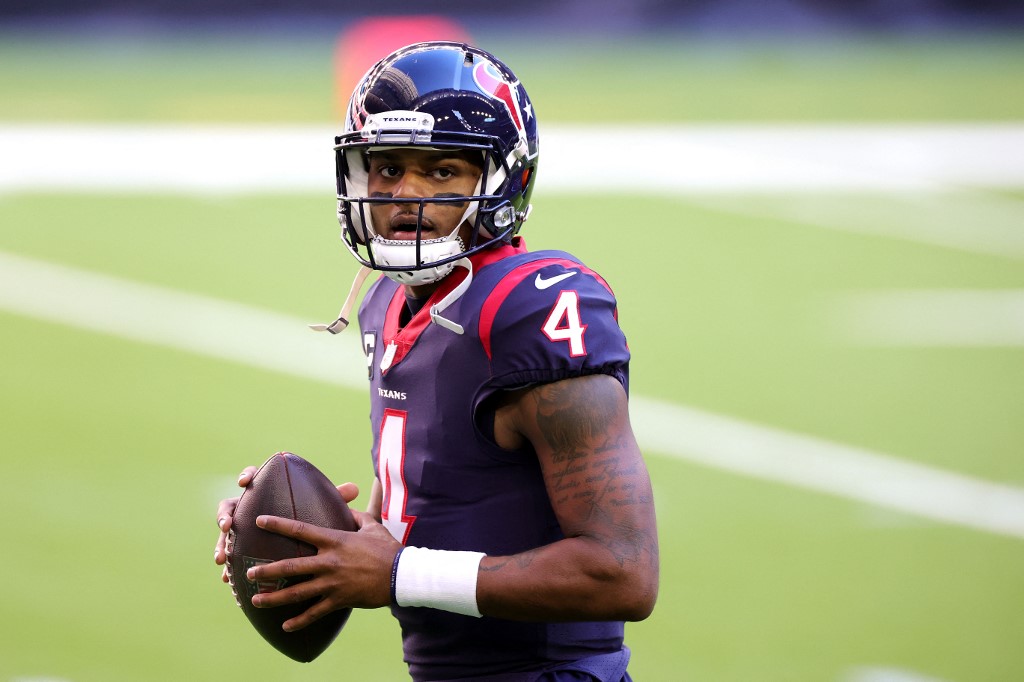 (FILES) In this file photo taken on January 3, 2021 Deshaun Watson #4 of the Houston Texans in action against the Tennessee Titans during a game at NRG Stadium in Houston, Texas. - Houston Texans quarterback DeShaun Watson will not face criminal prosecution over allegations of sexual misconduct made by multiple massage therapists, prosecutors said on March 11, 2022.