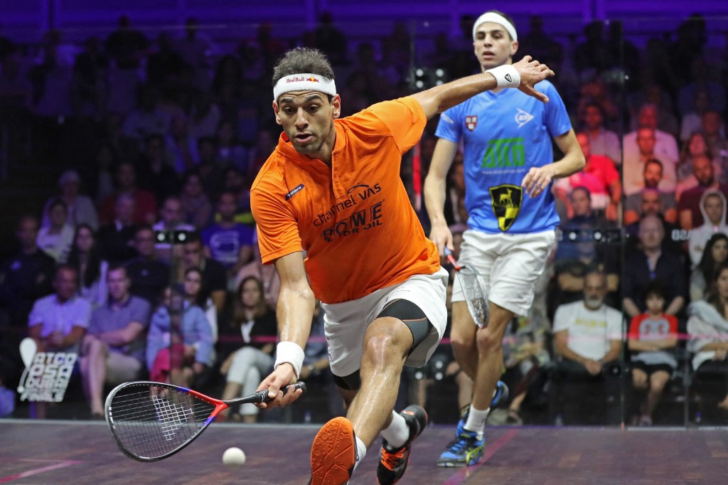 (FILES) In this file photo taken on June 09, 2018 Egyptians Mohamed el-Shorbagy (L) and Ali Farag compete during the PSA Dubai Squash World Series Finals 2018 at Dubai Emirates Golf club in Dubai. - Russia's war on Ukraine has drawn unprecedented sanctions that have seen it banned from most international sports in a Western-led break with the long-standing convention against politics mixing with sport.For many Arabs, who have seen their own sportsmen and women punished for refusing to compete with Israelis in protest at successive wars, the exception made for a European conflict smacks of double standards.