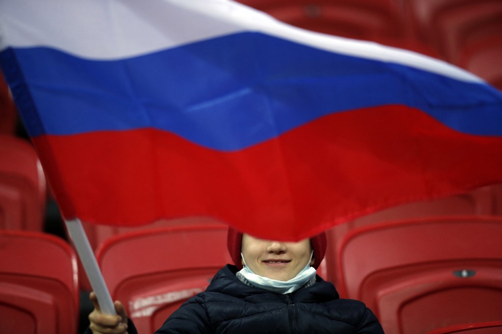 ves a Russian flag before the FIFA World Cup Qatar 2022 qualification football match between Russia and Slovakia at Kazan's Ak Bars Arena on October 8, 2021.