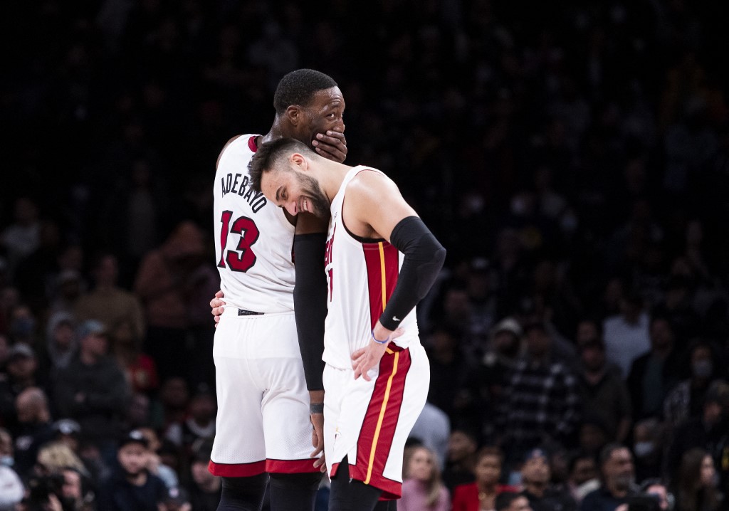  Bam Adebayo #13 and Max Strus #31 of the Miami Heat show emotion as they defeat the Brooklyn Nets at Barclays Center on March 3, 2022 in the Brooklyn borough of New York City.