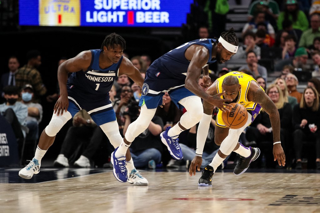 Patrick Beverley #22 of the Minnesota Timberwolves steals the ball from LeBron James #6 of the Los Angeles Lakers in the third quarter at Target Center on March 16, 2022 in Minneapolis, Minnesota. 