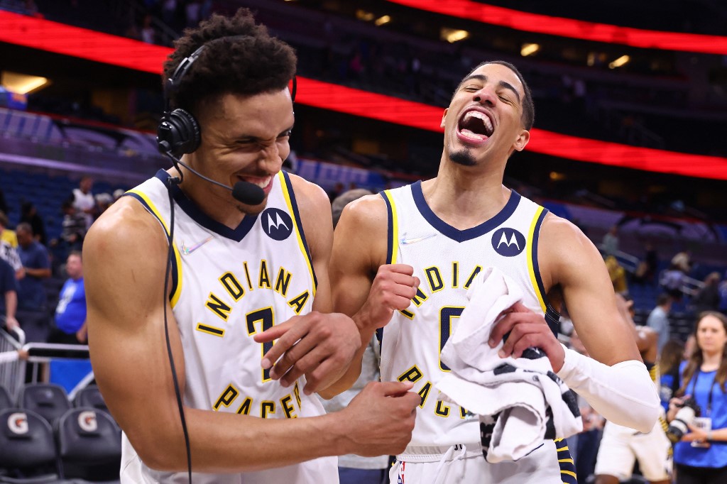 ORLANDO, FLORIDA - MARCH 02: Tyrese Haliburton #0 of the Indiana Pacers celebrates with Malcolm Brogdon #7 after defeating the Orlando Magic 122-114 in overtime at Amway Center on March 02, 2022 in Orlando, Florida