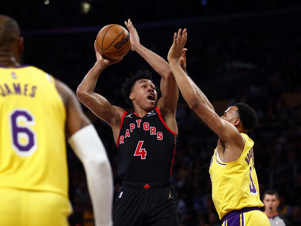 Scottie Barnes #4 of the Toronto Raptors takes a shot against Talen Horton-Tucker #5 of the Los Angeles Lakers in the second quarter at Crypto.com Arena on March 14, 2022 in Los Angeles, California.