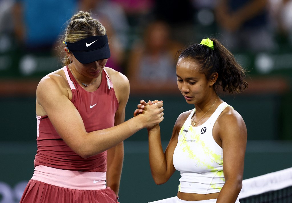 Paula Badosa of Spain shakes hands at the net after her straight sets victory against Leylah Fernandez of Canada in their fourth round match on Day 9 of the BNP Paribas Open at the Indian Wells Tennis Garden on March 15, 2022 in Indian Wells, California.   