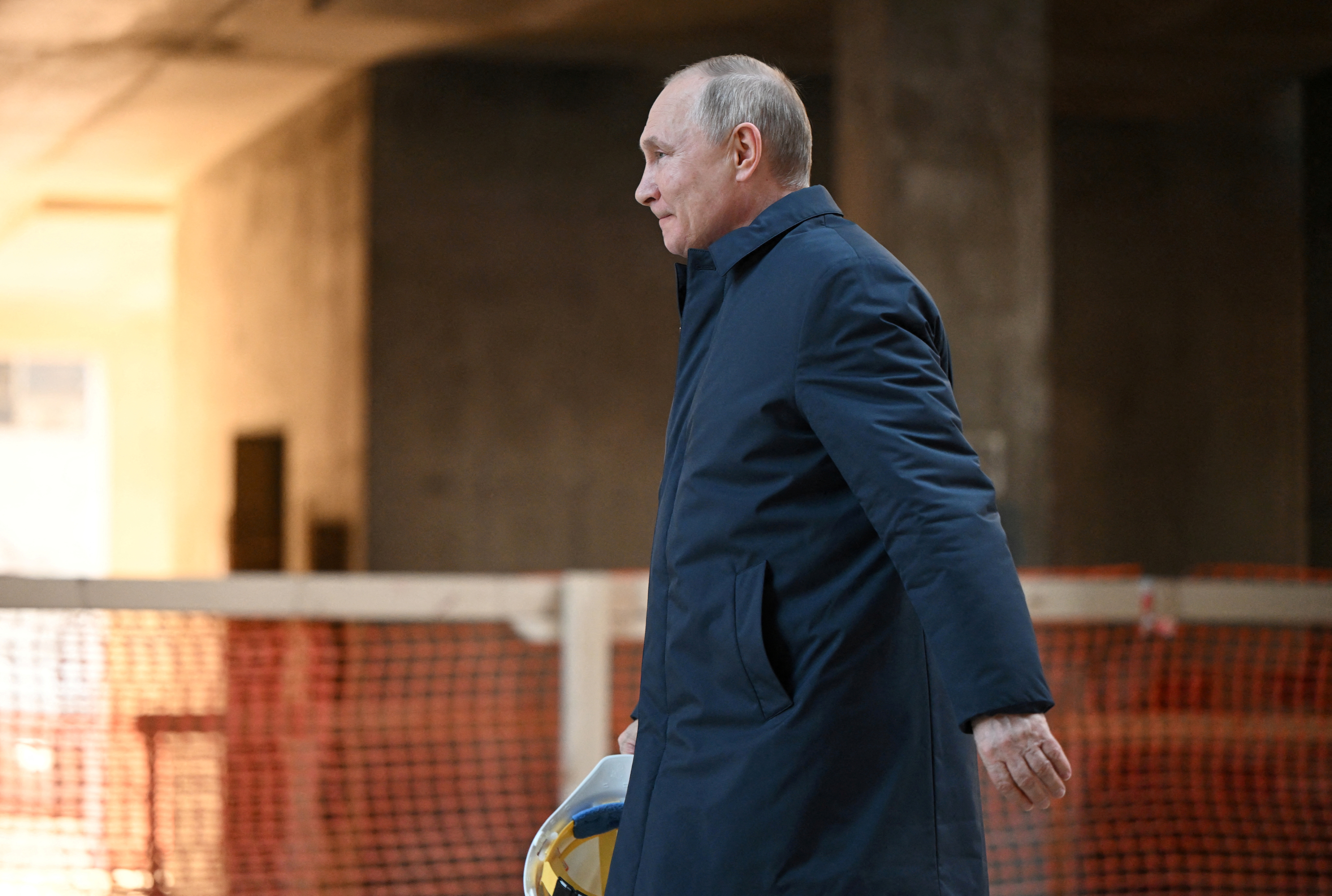 Russian President Vladimir Putin visits the construction site of the National Space Agency on the premises of the Khrunichev State Research and Production Space Centre, in Moscow, Russia February 27, 2022. 