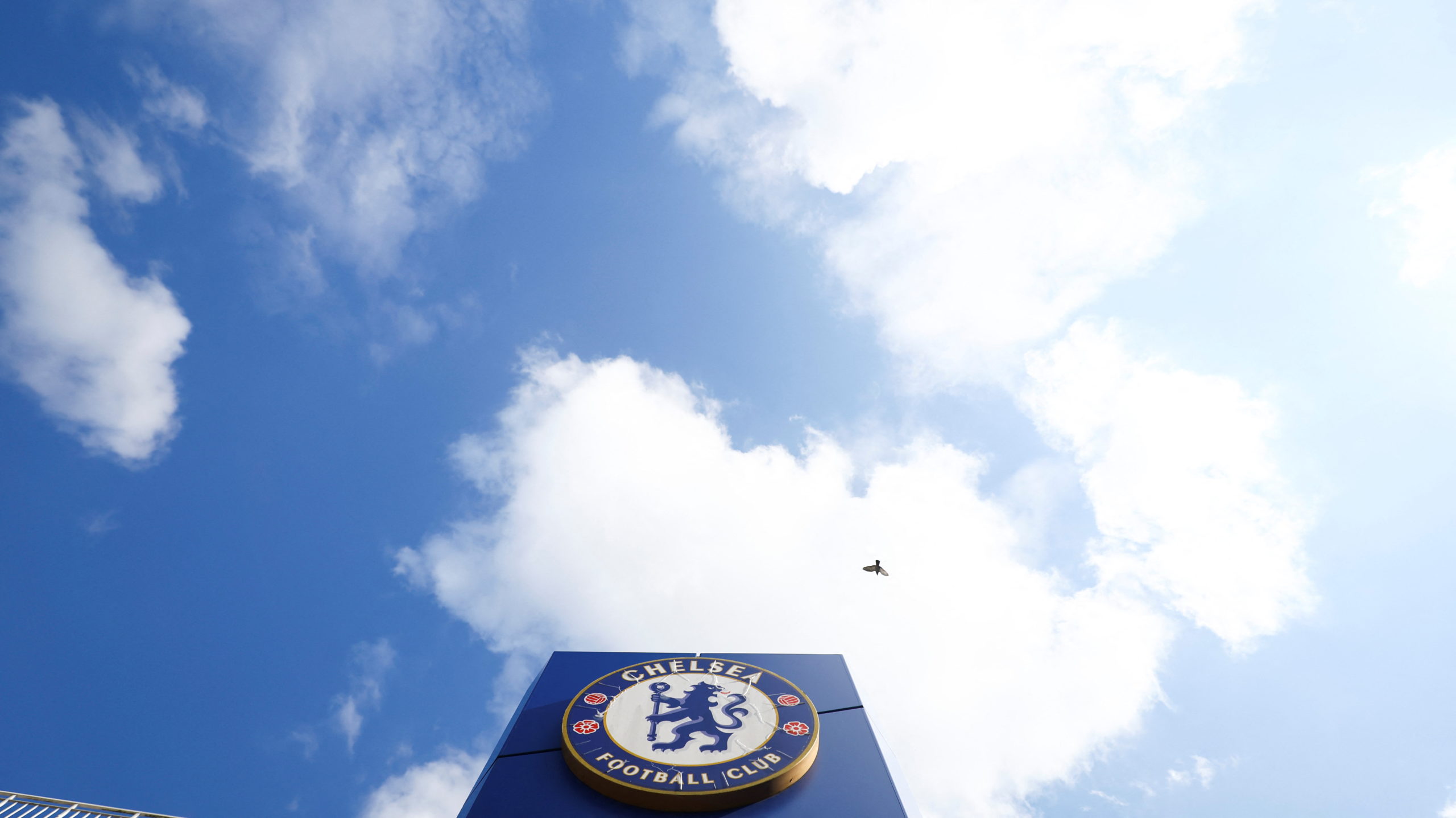 FILE PHOTO: The logo of Chelsea Football Club is pictured outside Stamford Bridge, the stadium for Chelsea Football Club, after Britain imposed sanctions on its Russian owner, Roman Abramovich, in London, Britain, March 10, 2022.