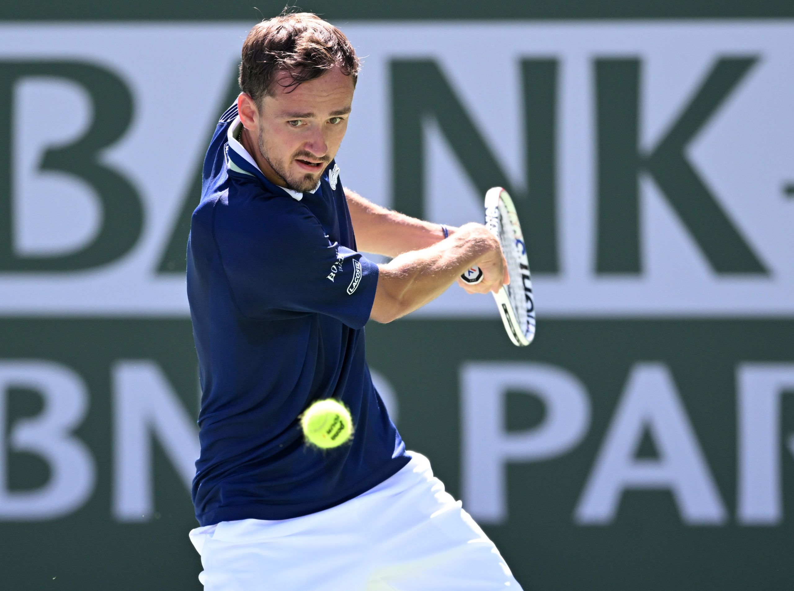 Mar 14, 2022; Indian Wells, CA, USA;  Daniil Medvedev (RUS) hits a shot in his third round match against Gael Monfils (FRA) during the BNP Paribas Open at the Indian Wells Tennis Garden.