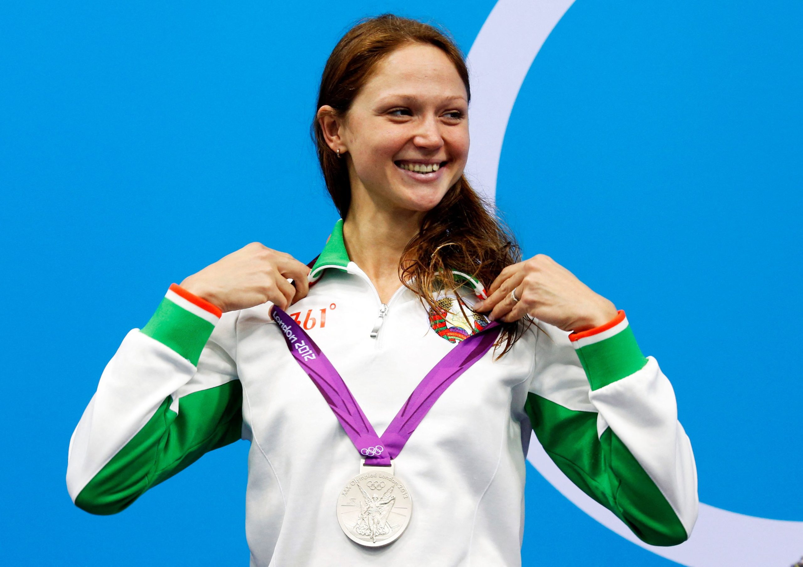 FILE PHOTO: Belarus' Aliaksandra Herasimenia smiles with her silver medal during the women's 100m freestyle victory ceremony during the London 2012 Olympic Games at the Aquatics Centre August 2, 2012. 