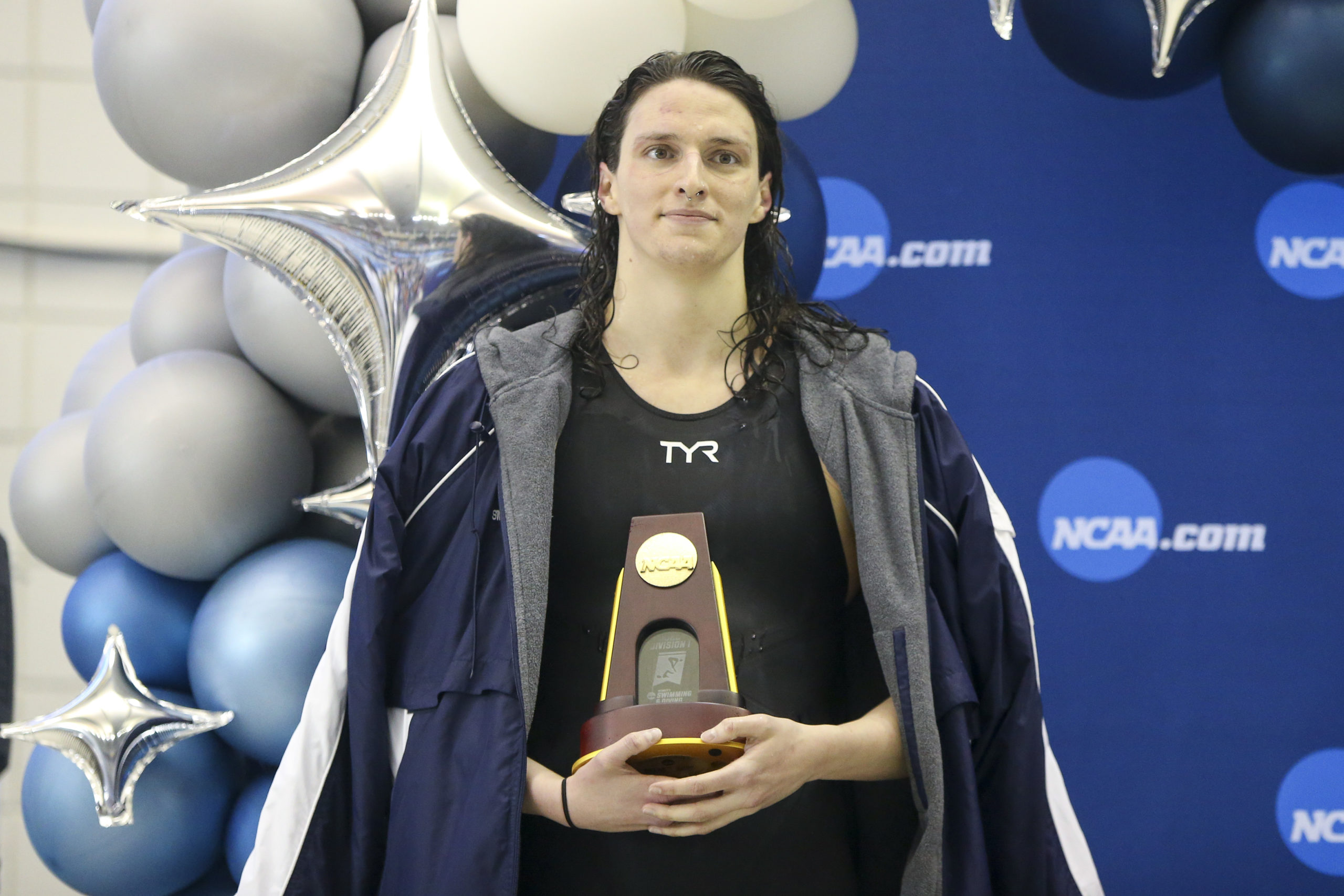 Mar 17, 2022; Atlanta, Georgia, USA; Penn Quakers swimmer Lia Thomas holds a trophy after finishing first in the 500 free at the NCAA Womens Swimming & Diving Championships at Georgia Tech.