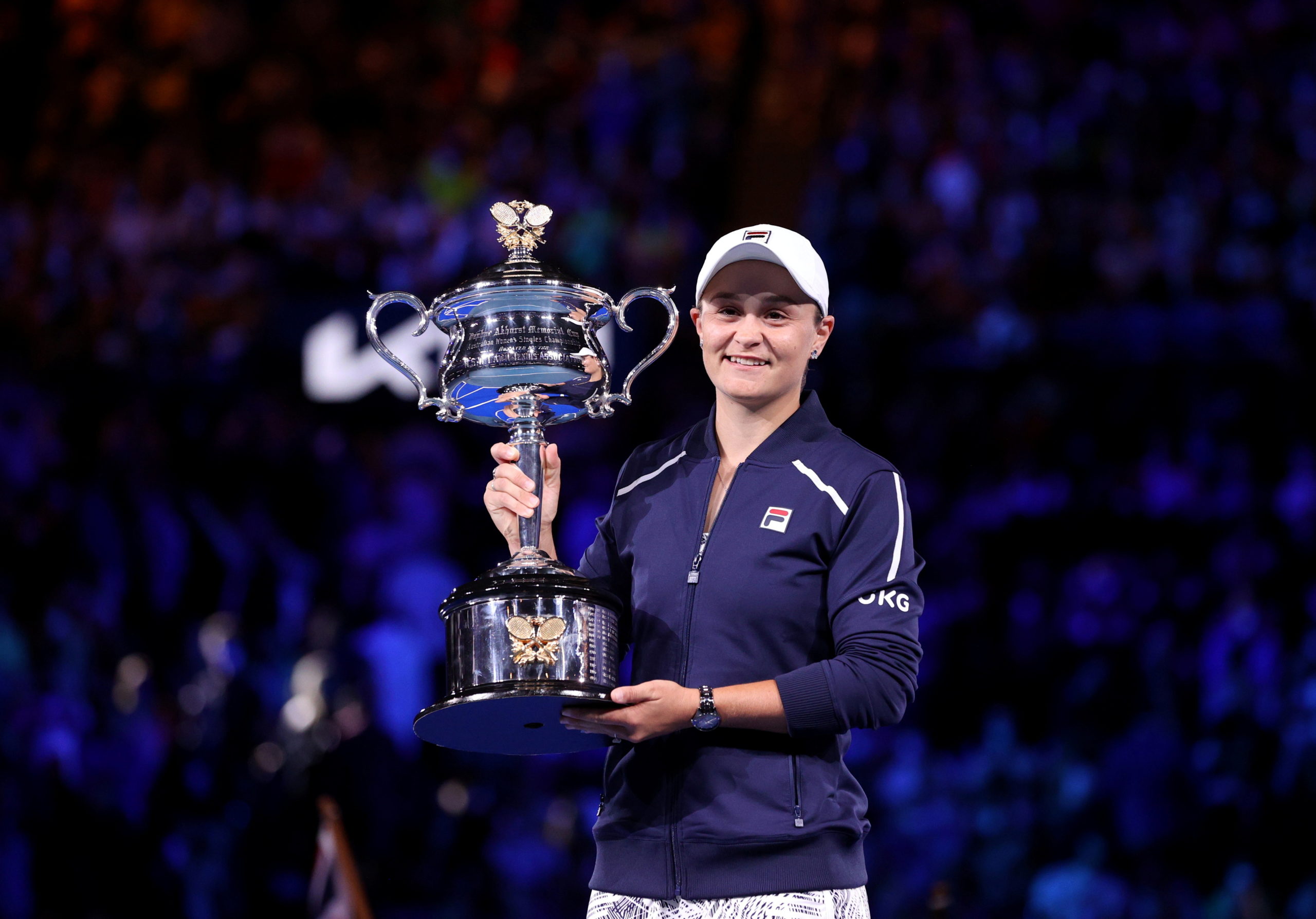 FILE PHOTO: Tennis - Australian Open - Women's Singles Final - Melbourne Park, Melbourne, Australia - January 29, 2022 Australia's Ashleigh Barty poses as she celebrates winning the final against Danielle Collins of the U.S. with the trophy 