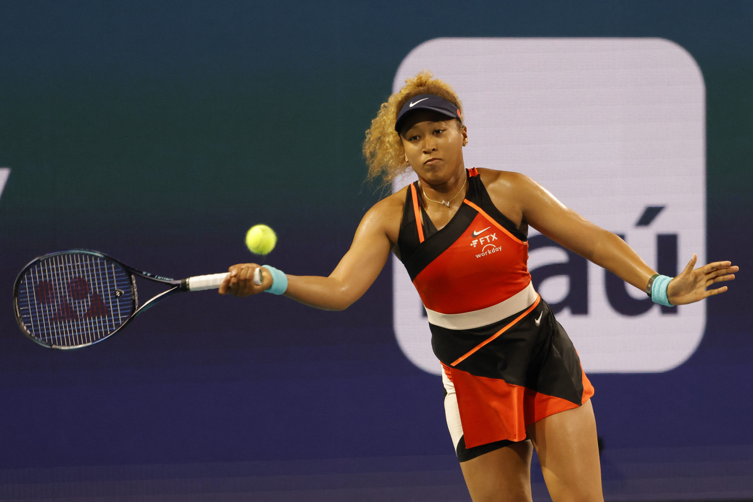 Mar 29, 2022; Miami Gardens, FL, USA; Naomi Osaka (JPN) hits a forehand against Danielle Collins (USA)(not pictured) in a women's singles quarterfinal in the Miami Open at Hard Rock Stadium.