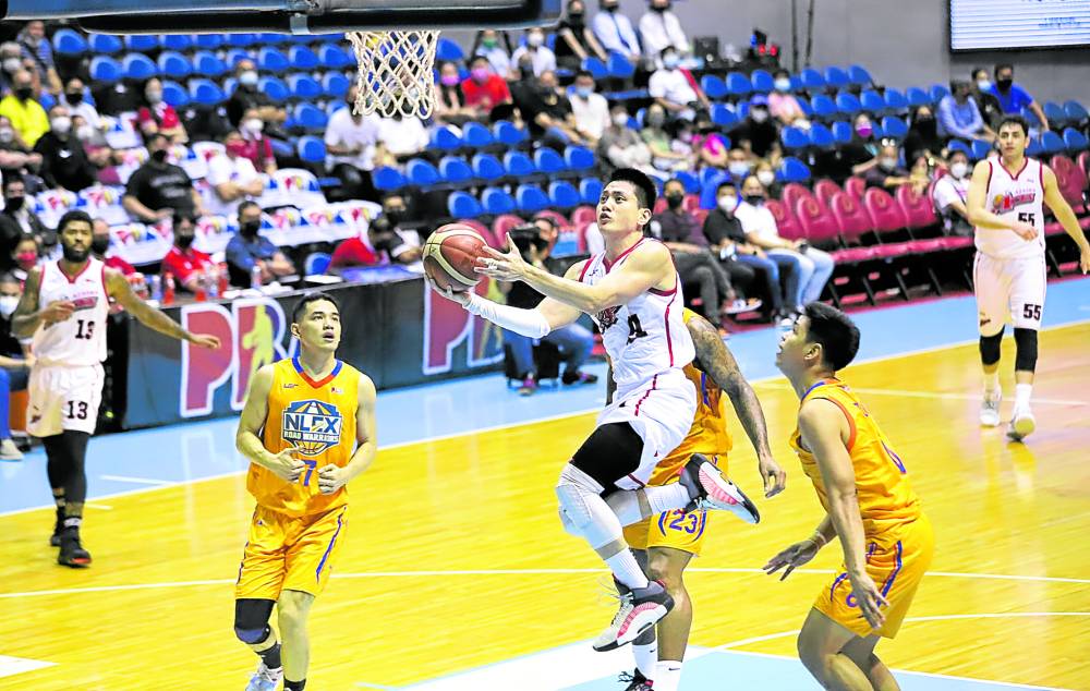 Alaska star Jeron Teng soars to the basket against the NLEX defense. Teng fueled a second quarter run that gave the Aces a chance to showcase their brand of basketball for another playdate.