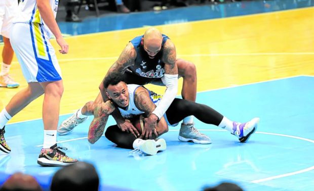 Tony Bishop Jr. (on top) bottles up Calvin Abueva to highlight a terrific defensive effort by the Bolts in Game 3. —PHOTOS FROM PBA IMAGES