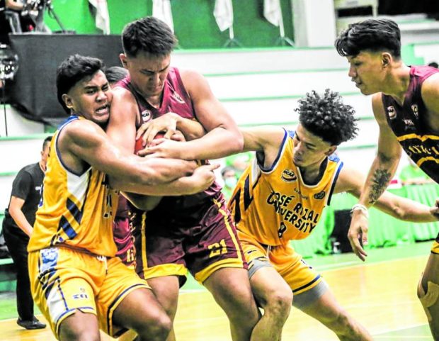 Players of Perpetual Help and Jose Rizal U get caught up in a fierce battle for possession. —PHOTO COURTESY OF NCAA/GMA 